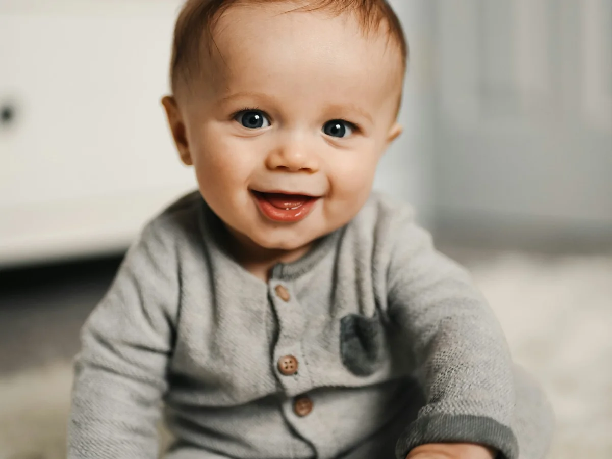 Representative baby clothing photography for the fictional product Soft Nest Romper