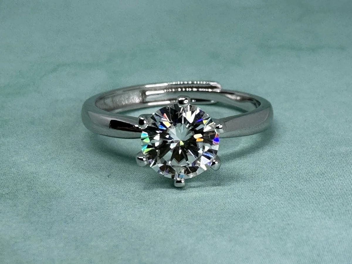 Representative diamond jewellery store photography for the fictional product Aster Solitaire Ring