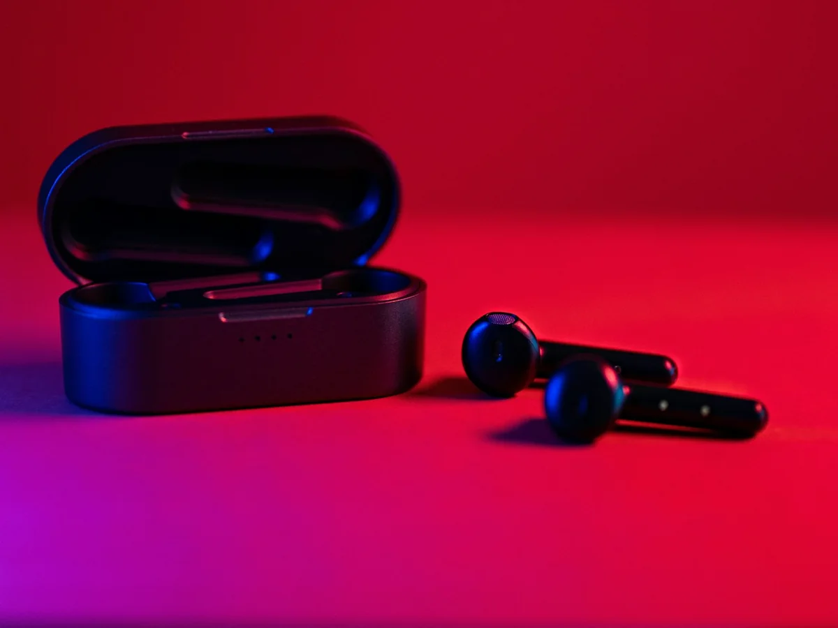 Representative electronics and mobile accessories photography for the fictional product Current Wireless Earbuds