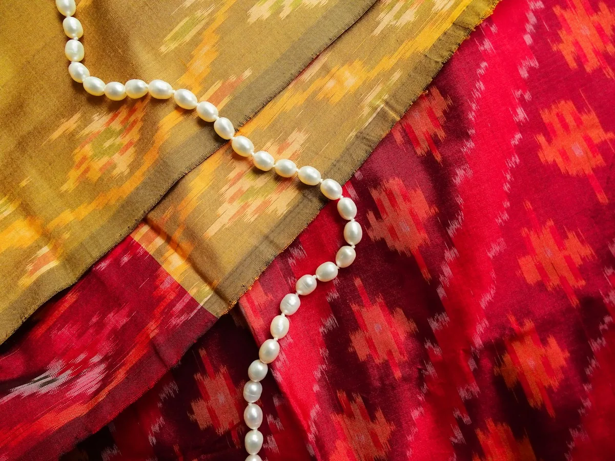 Representative fabric and textile store photography for the fictional product Ikat Dress Material