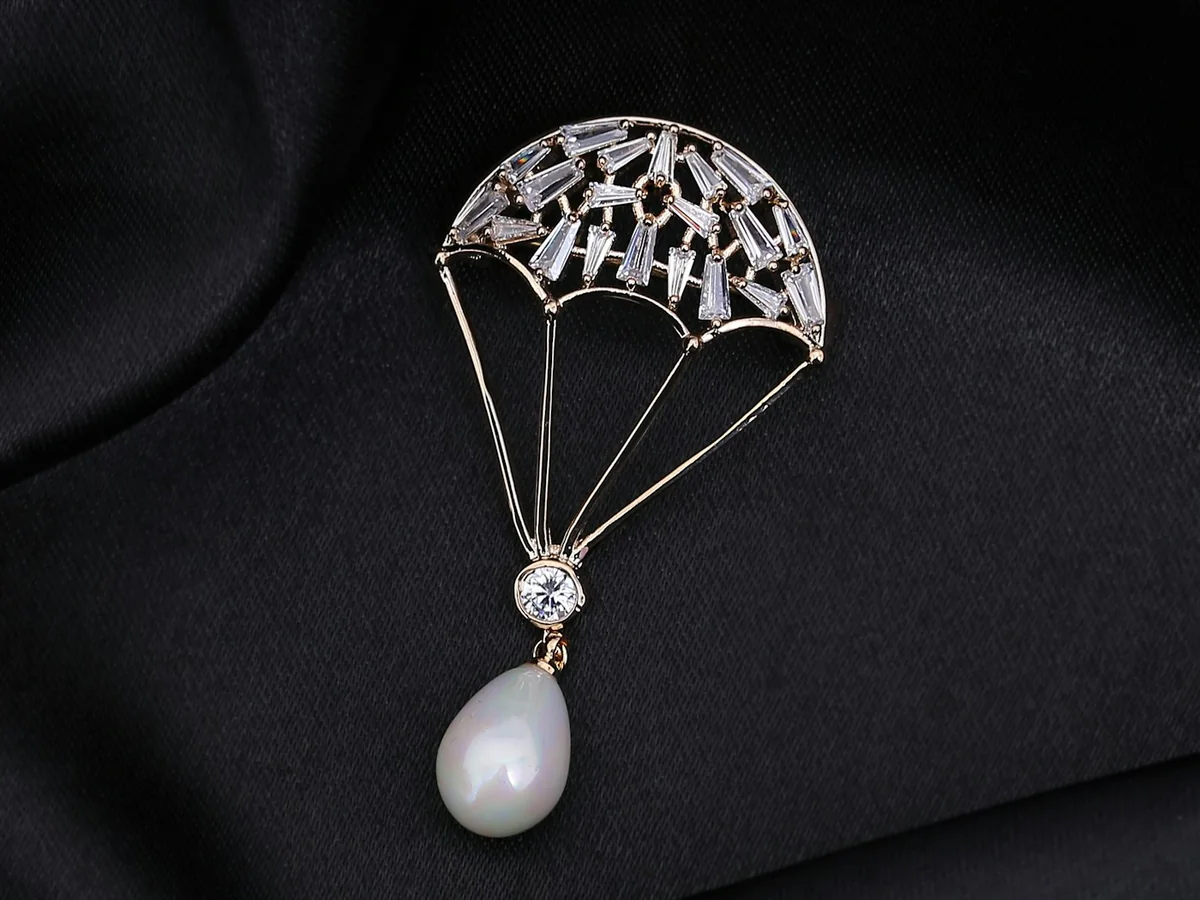 Representative fashion accessories photography for the fictional product Statement Metal Brooch