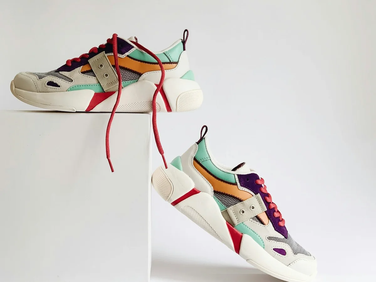 Representative footwear store photography for the fictional product Grounded Everyday Sneaker