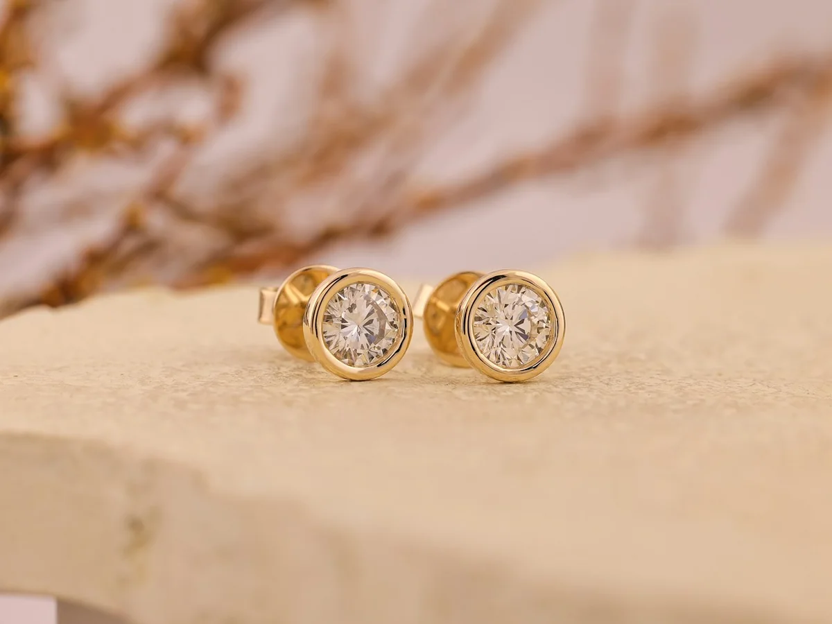 Representative gold jewellery store photography for the fictional product Everyday Gold Studs