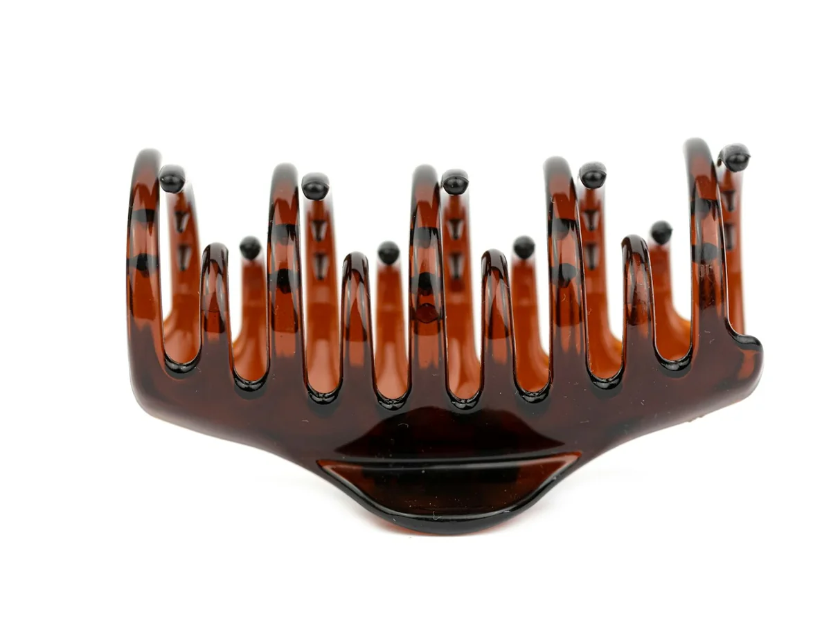 Representative hair accessories photography for the fictional product Petal Hair Clip