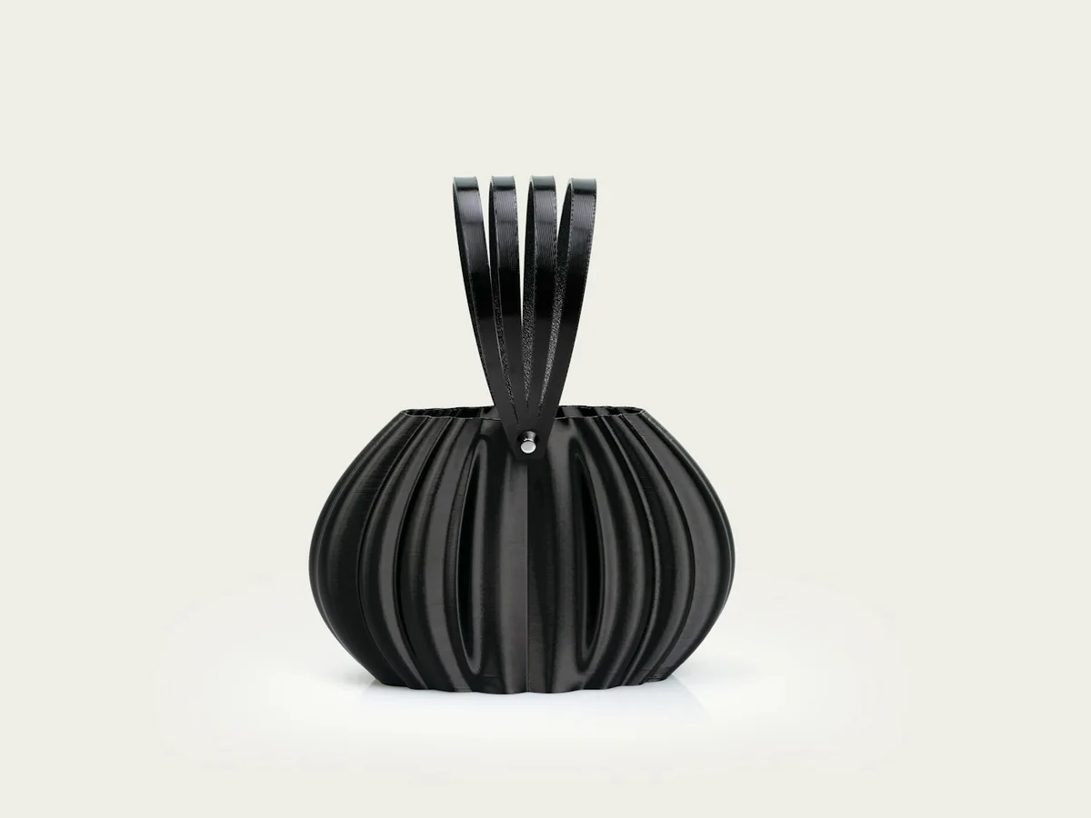 Representative handbag and purse store photography for the fictional product Evening Sculpted Clutch