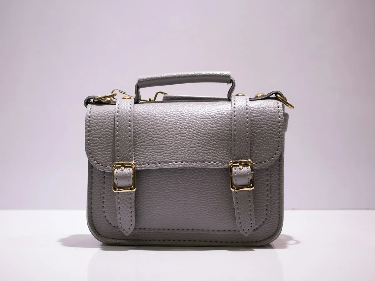 Representative handbag and purse store photography for the fictional product Compact Crossbody Bag