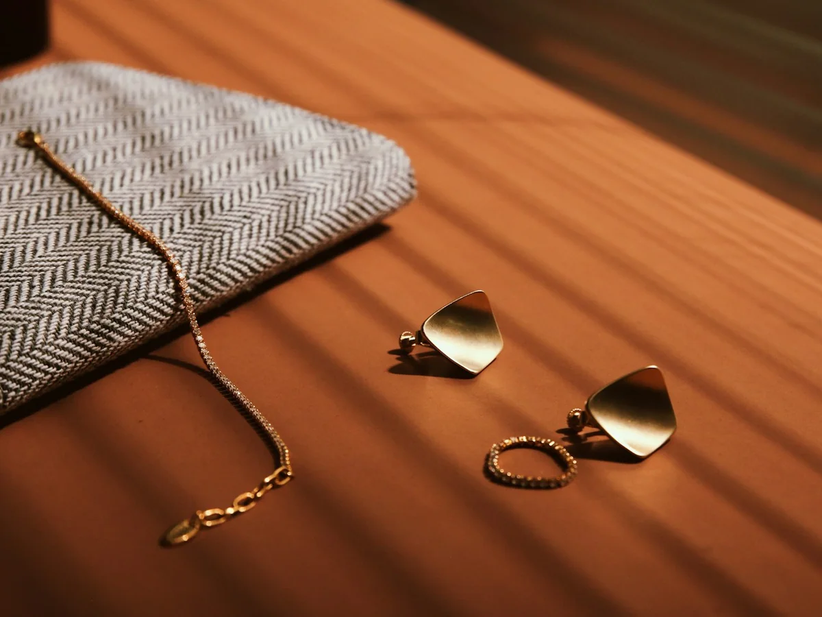 Representative handmade jewellery photography for the fictional product Hammered Brass Earrings