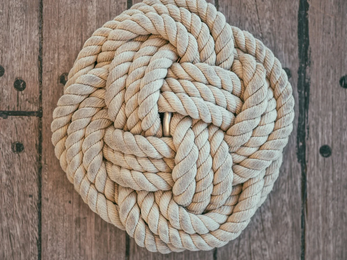 Representative handmade jewellery photography for the fictional product Textile Knot Brooch