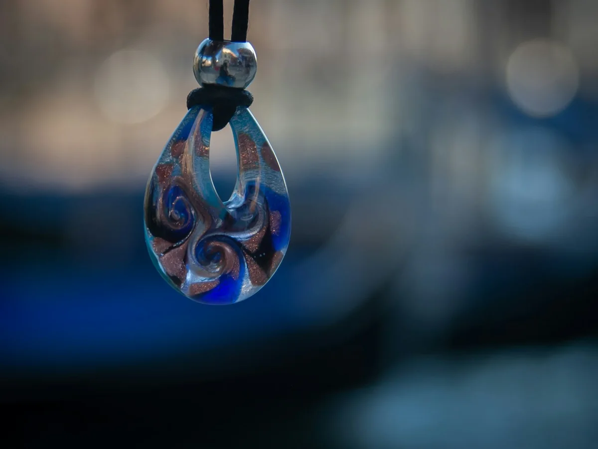 Representative handmade jewellery photography for the fictional product Handmade Metal Pendant