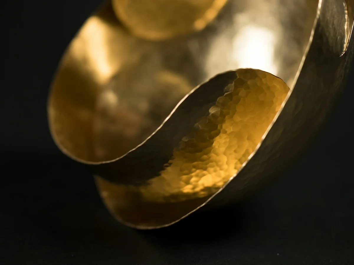 Representative handmade jewellery photography for the fictional product Artisan Brass Cuff