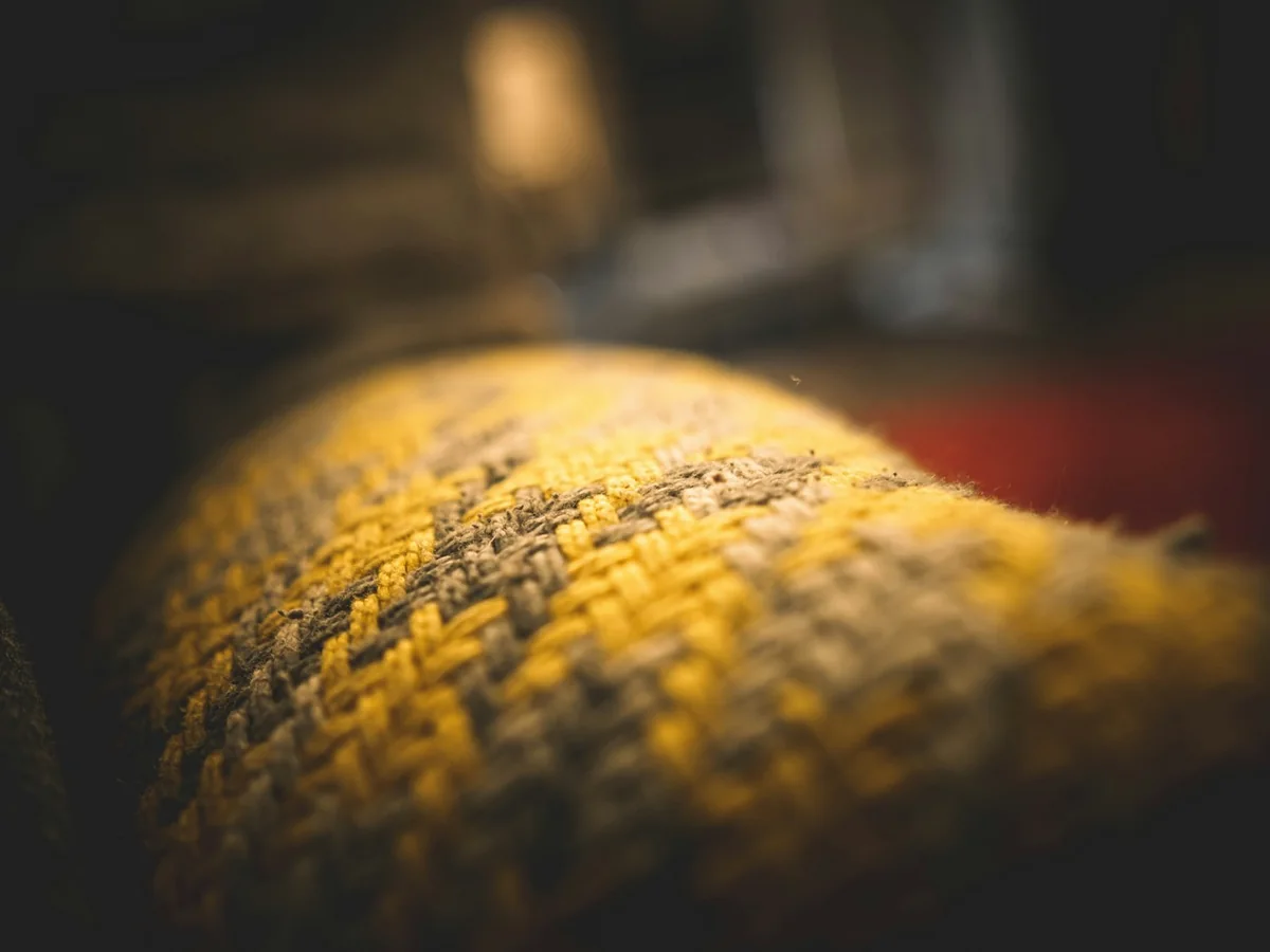Representative home decor store photography for the fictional product Woven Cushion Cover