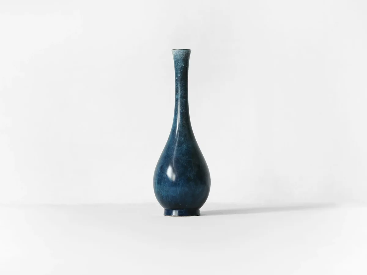 Representative home decor store photography for the fictional product Sculpted Table Vase
