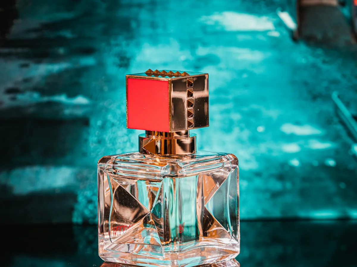 Representative perfume store photography for the fictional product Midnight Amber EDP