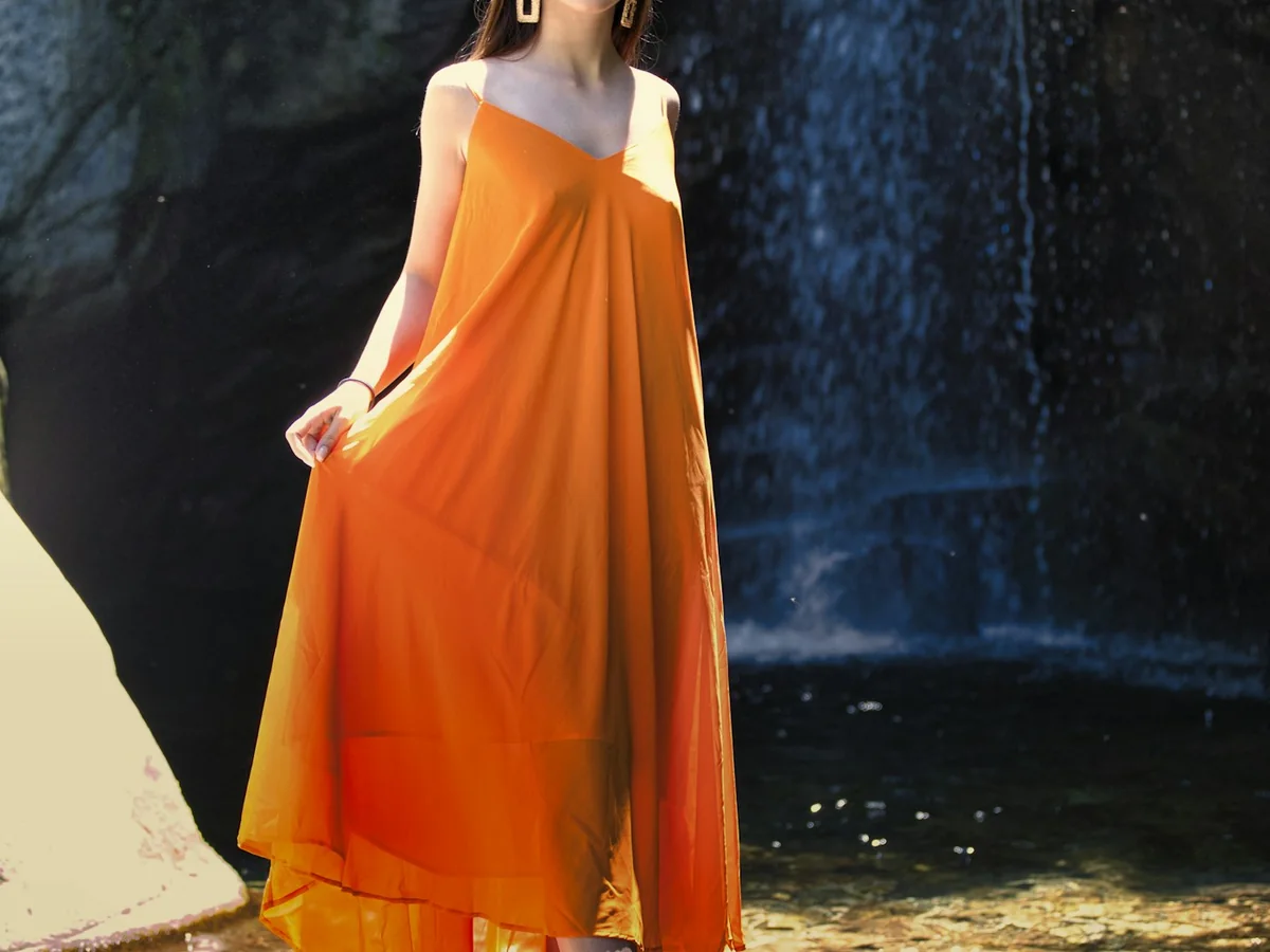 Representative plus-size fashion photography for the fictional product Flowy Occasion Dress