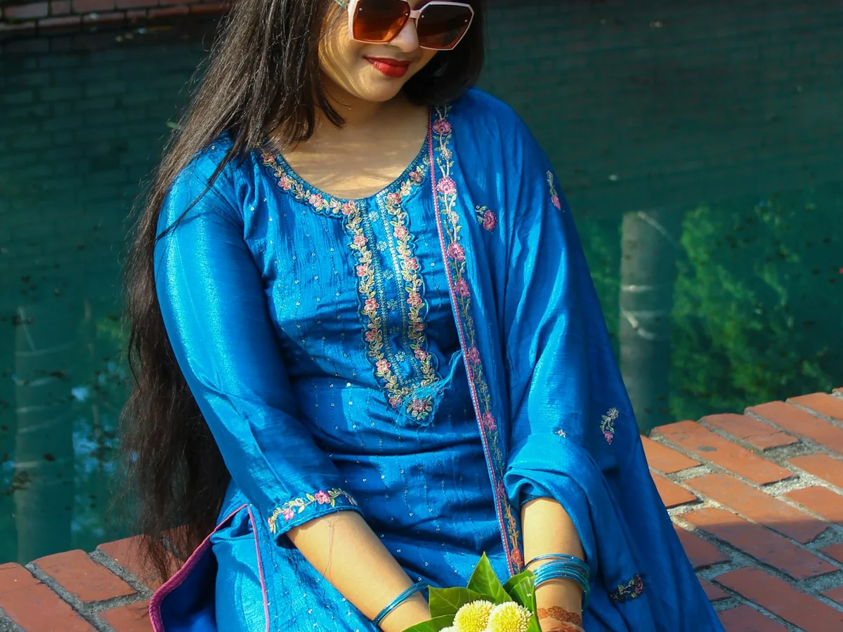 Representative salwar suit store photography for the fictional product Phool Embroidered Suit