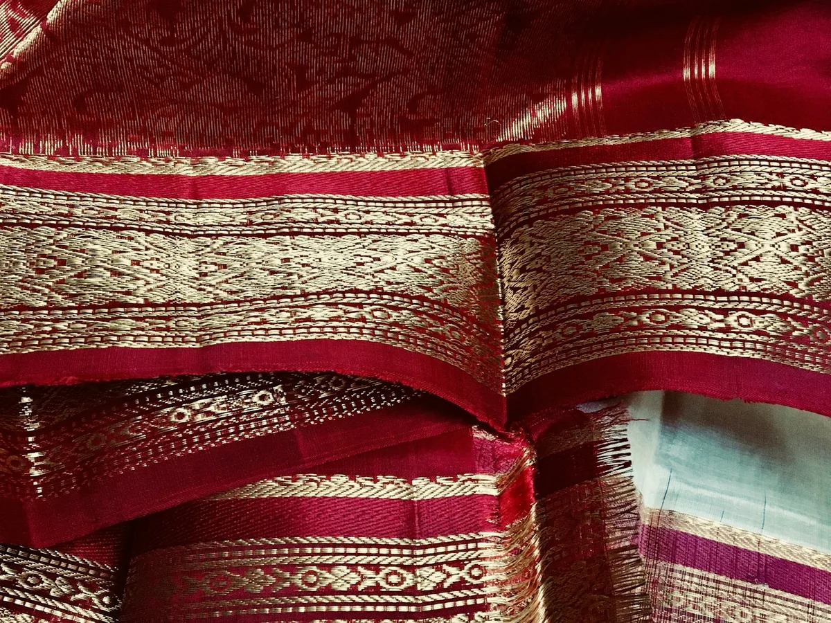 Representative saree shop photography for the fictional product Kaveri Kanjivaram Saree