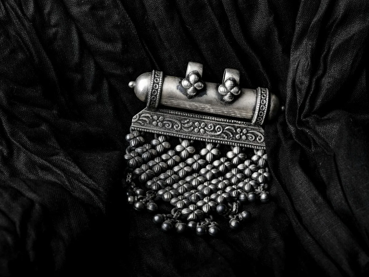 Representative silver jewellery store photography for the fictional product Tribal Silver Necklace