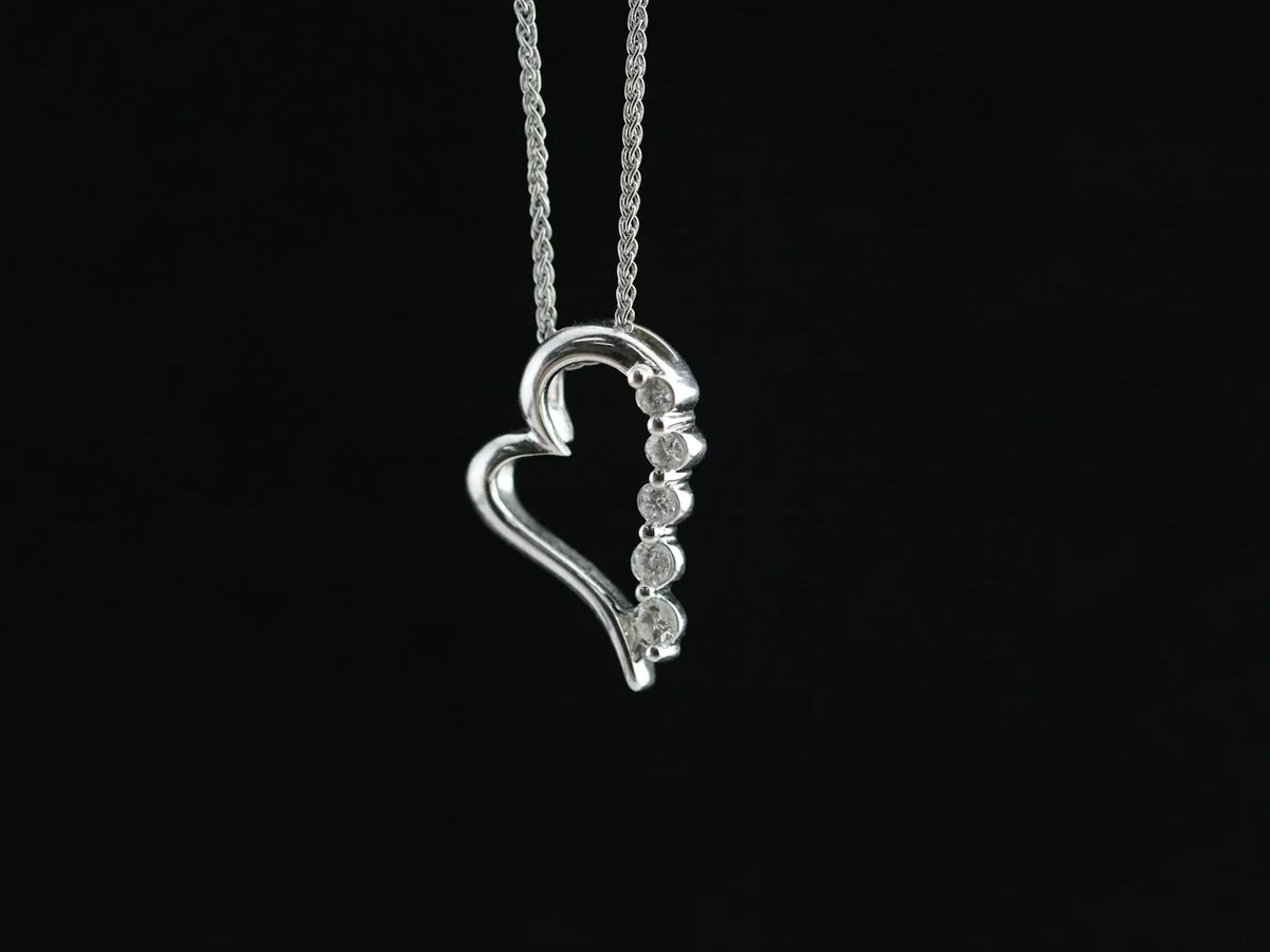 Representative silver jewellery store photography for the fictional product Contemporary Silver Pendant
