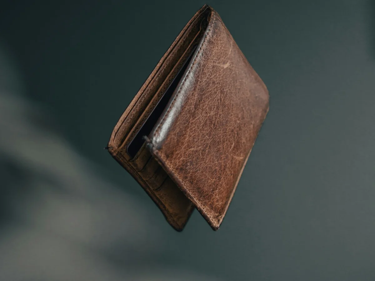 Representative wallets and leather goods photography for the fictional product Form Full-grain Wallet